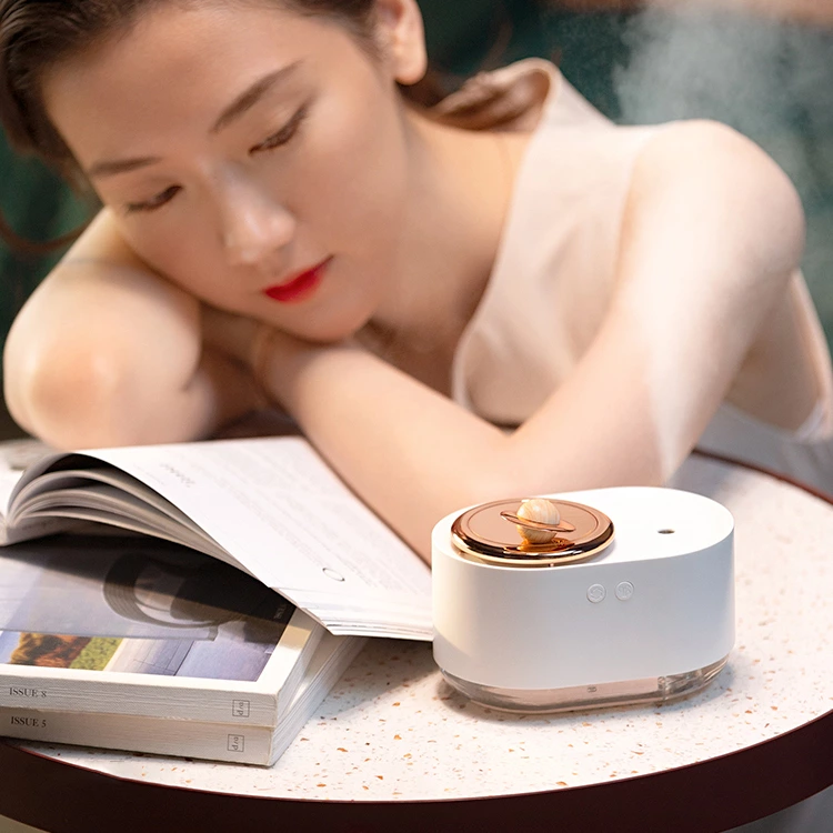 Experience the Future of Hydration with Our Rotating Planet Humidifier