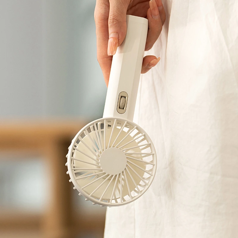 Beat the Summer Heat with Our Portable Handheld Fan: A Must-Have Cooling Companion