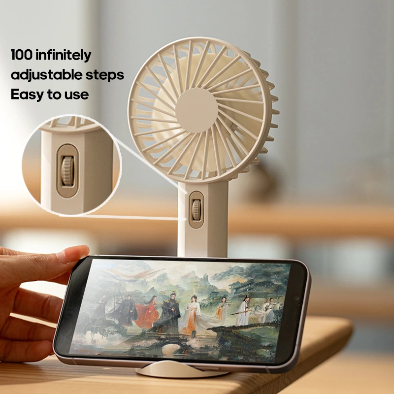 Beat the Summer Heat with Our Portable Handheld Fan: A Must-Have Cooling Companion